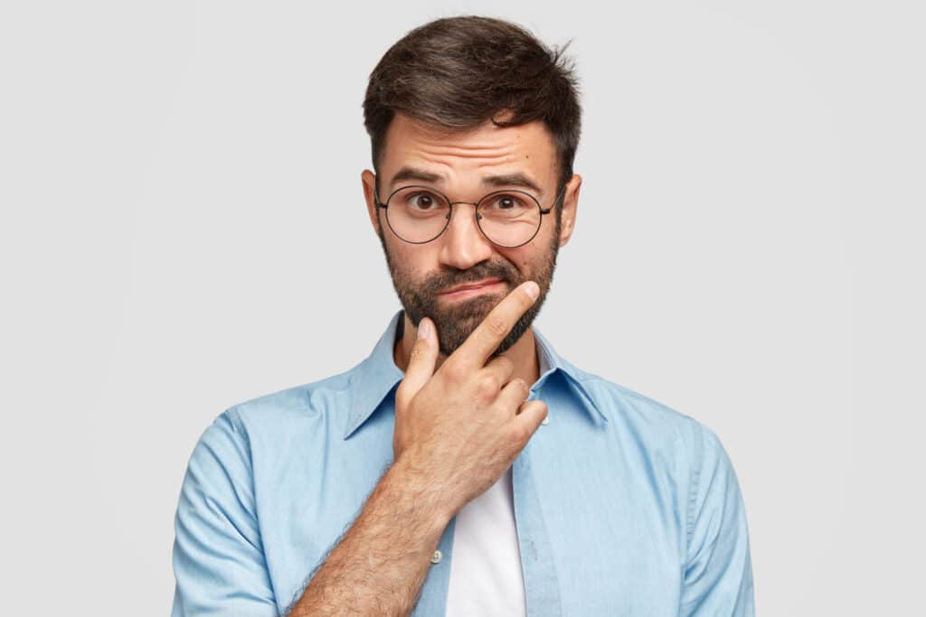 Man pondering common English mistakes