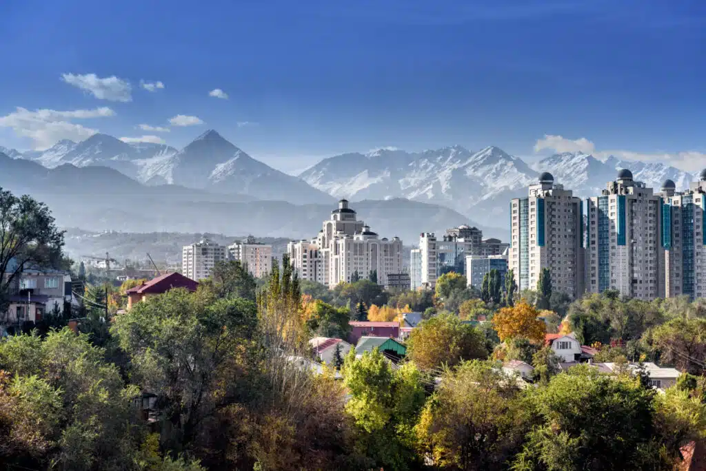 City landscape of Almaty on a background of snow-capped mountains
