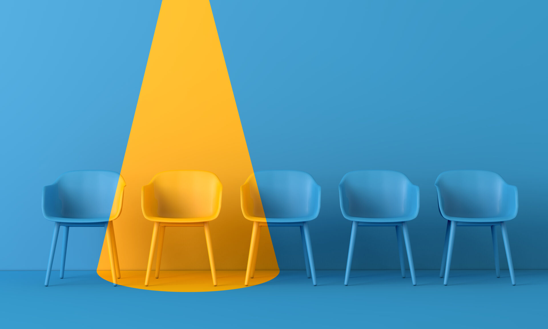 A row of chairs in an interview situation, one chair is in a spotlight